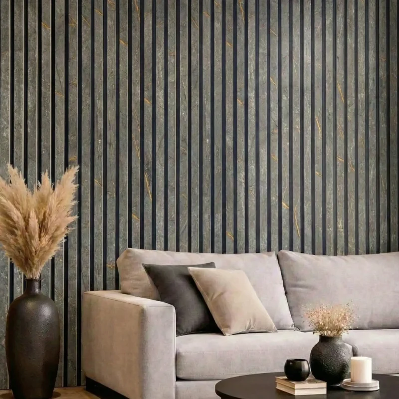 Black and gold marble acoustic slat panels featured behind a grey sofa in a modern lounge.