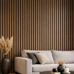 Dark oak acoustic slat wood panels installed as a feature wall behind a grey sofa in a modern lounge.