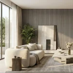 Light grey acoustic slat wood panels feature wall in a sunlit modern living room with cream sofa.