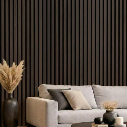 Smoked oak acoustic slat wood panels installed as a feature wall behind a grey sofa in a modern lounge.