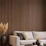 Walnut acoustic slat wood panels installed as a modern living room feature wall behind a grey sofa.